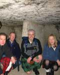 Crouching down in a cave monastery